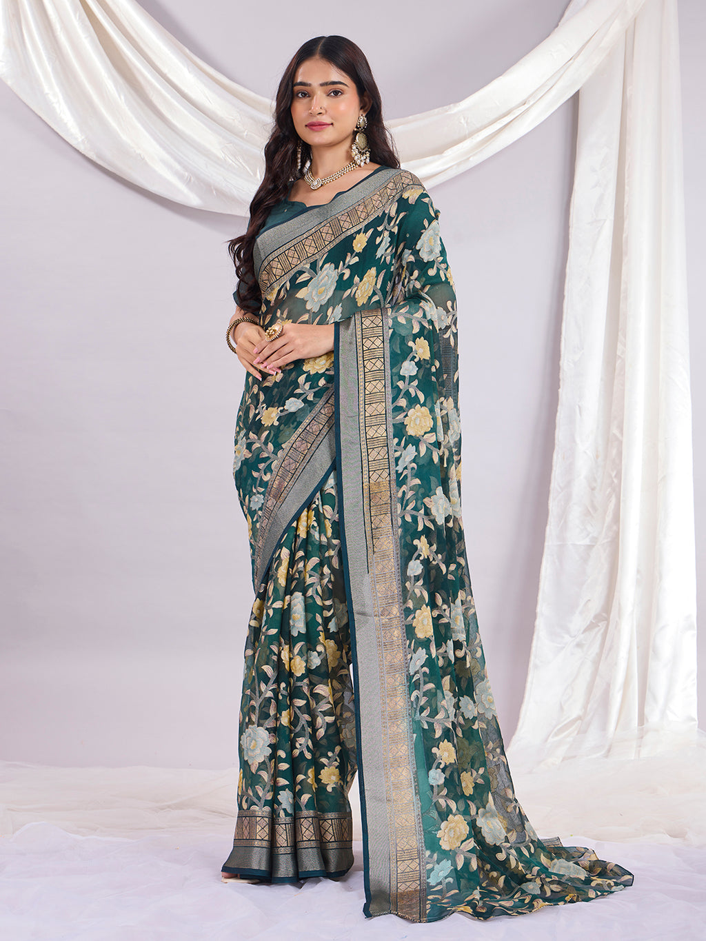 Premium Soft Brasso Saree With Fancy Blouse Piece.
