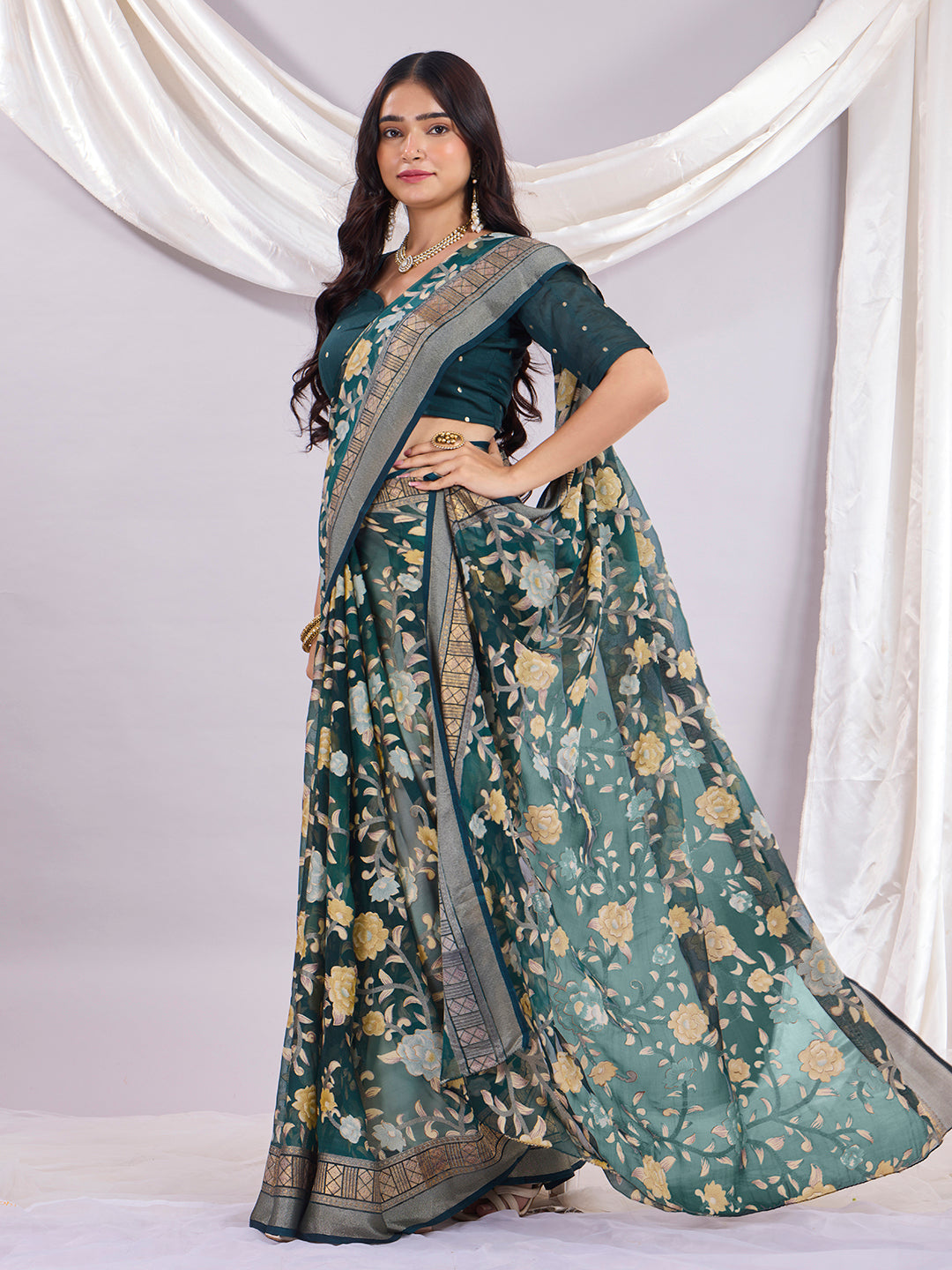 Premium Soft Brasso Saree With Fancy Blouse Piece.