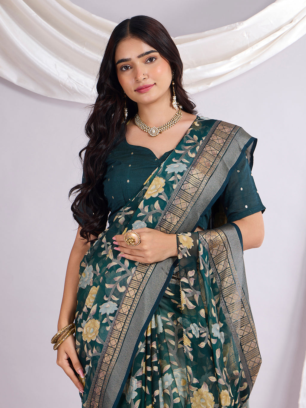 Premium Soft Brasso Saree With Fancy Blouse Piece.
