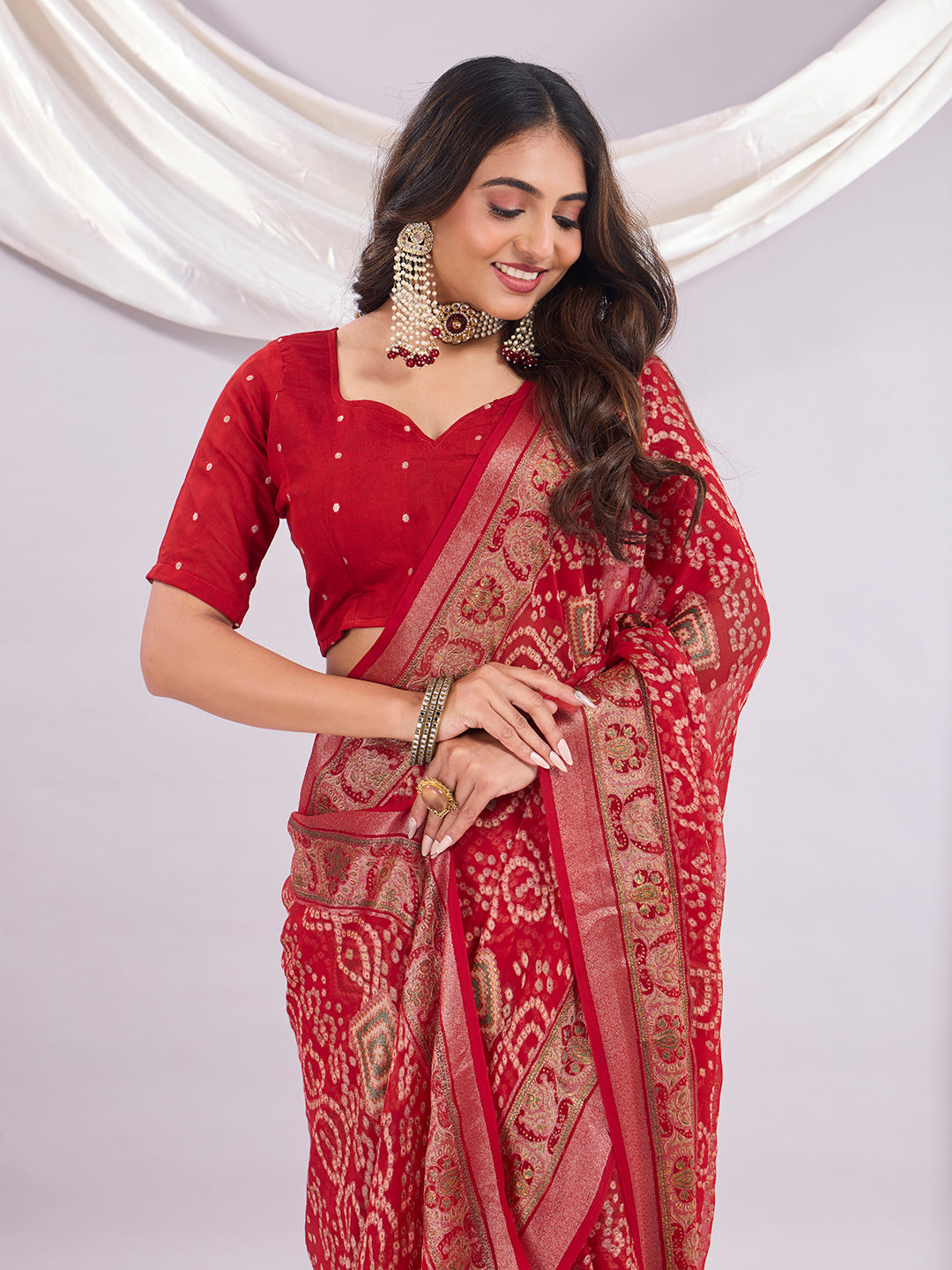 Premium Bandhani Brasso Saree With Fancy Unstitched Blouse Piece.