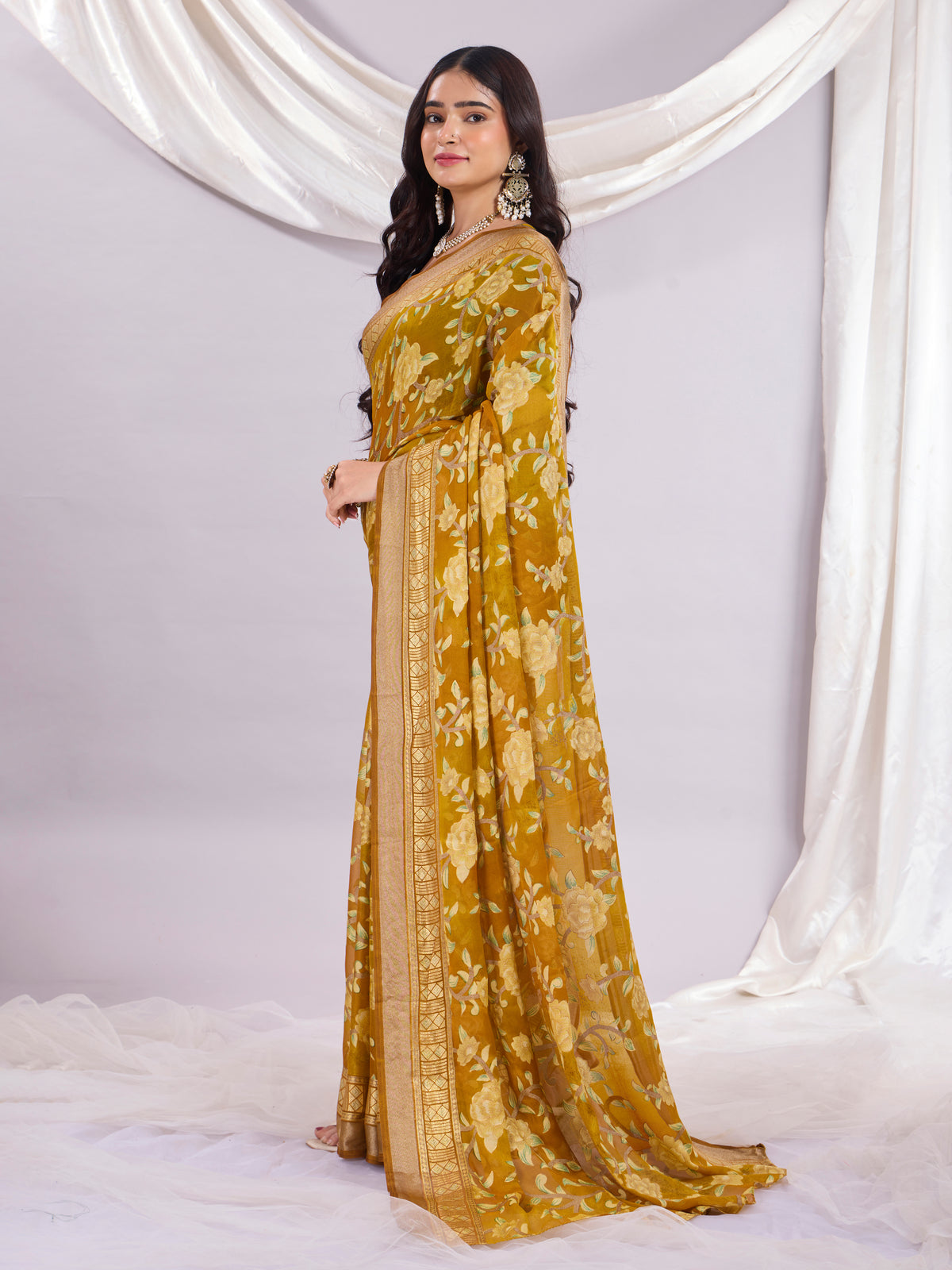 Premium Soft Brasso Saree With Fancy Blouse Piece.