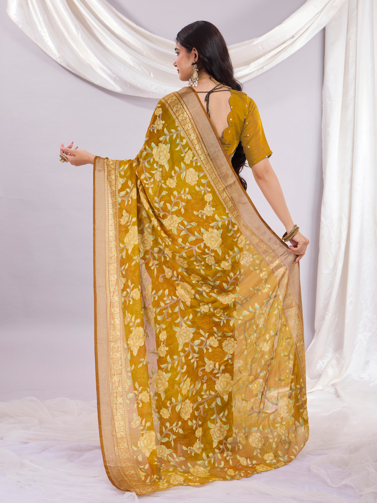 Premium Soft Brasso Saree With Fancy Blouse Piece.