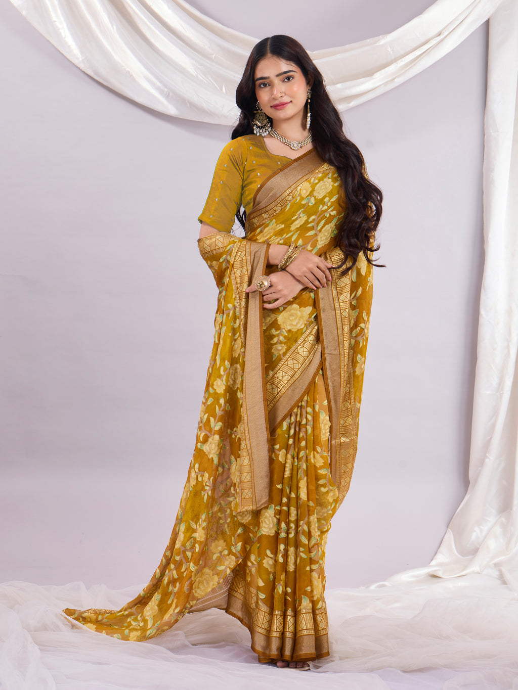 Premium Soft Brasso Saree With Fancy Blouse Piece.