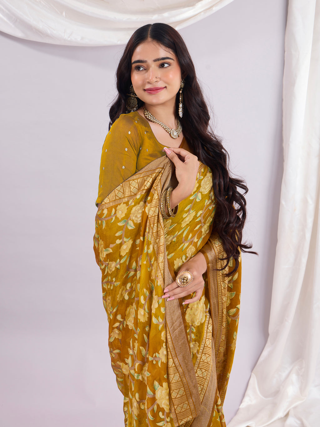 Premium Soft Brasso Saree With Fancy Blouse Piece.