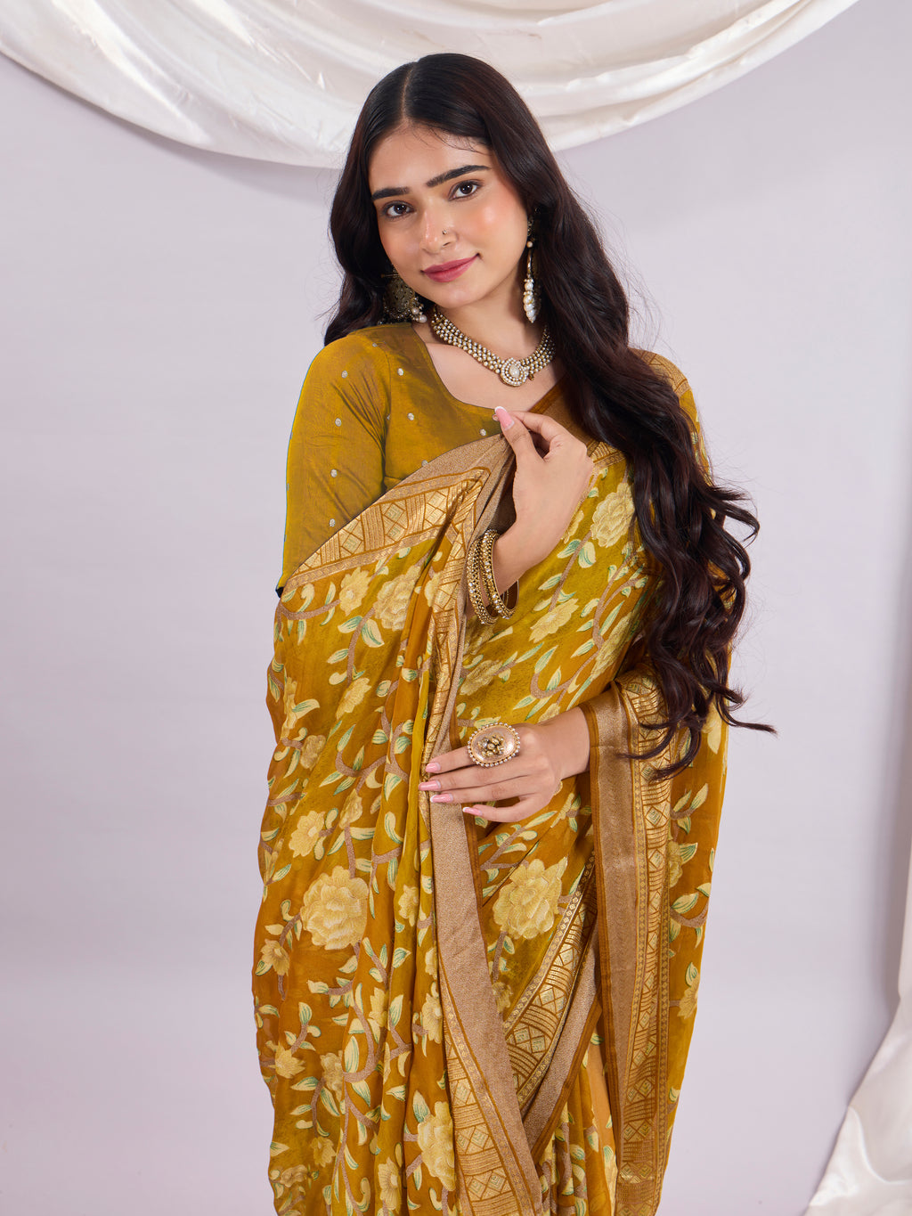 Premium Soft Brasso Saree With Fancy Blouse Piece.
