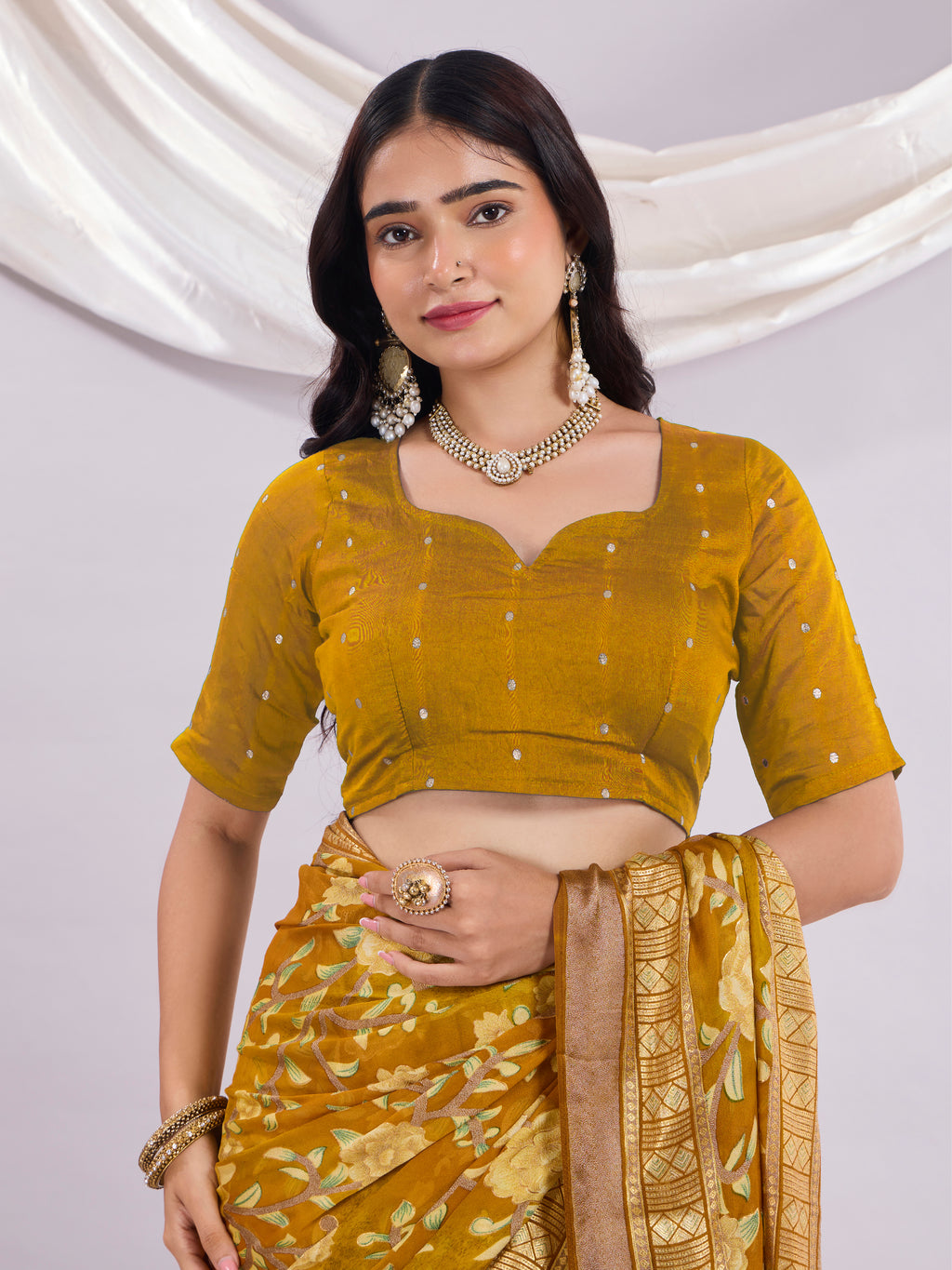 Premium Soft Brasso Saree With Fancy Blouse Piece.