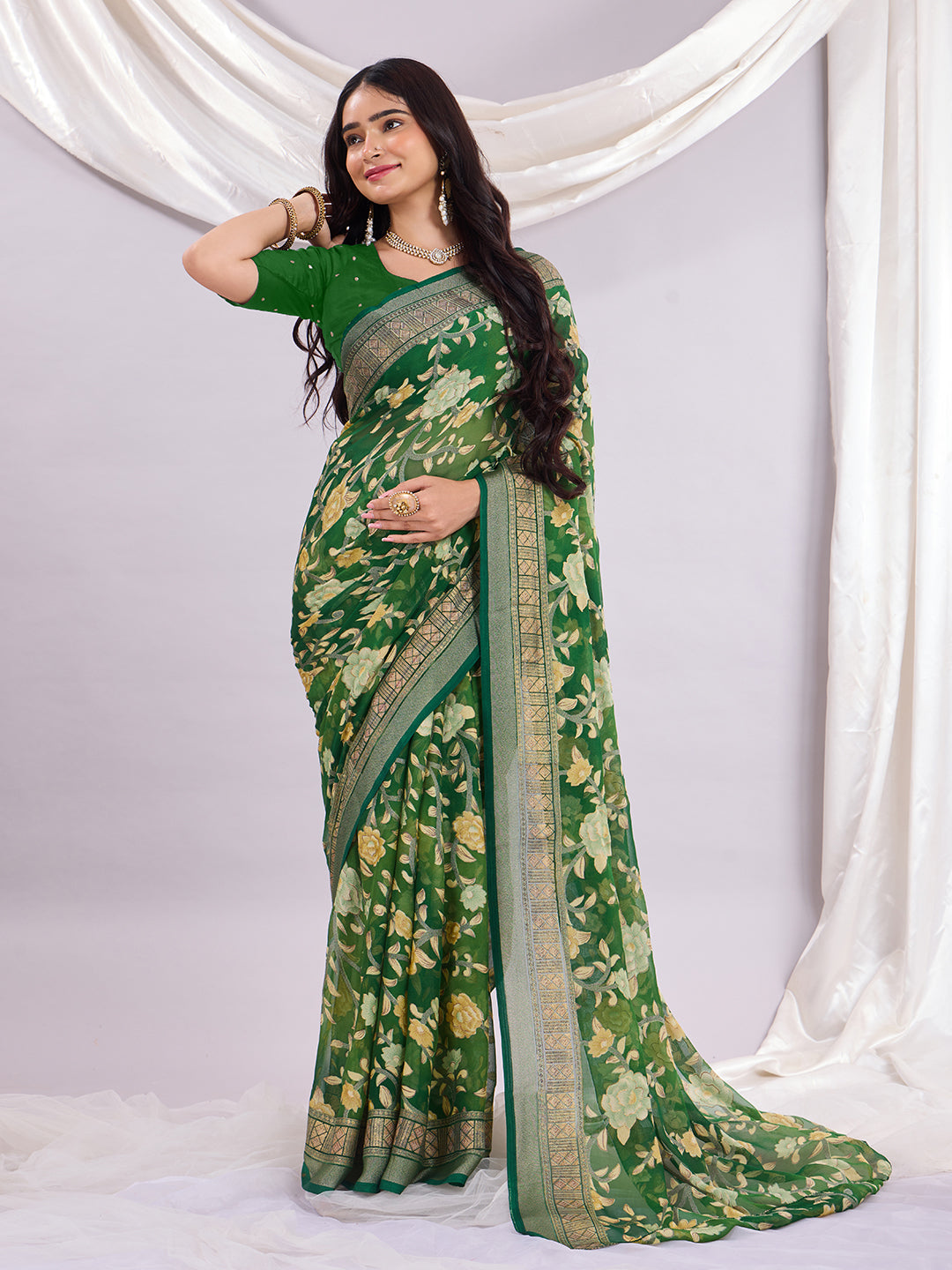 Premium Soft Brasso Saree With Fancy Blouse Piece.