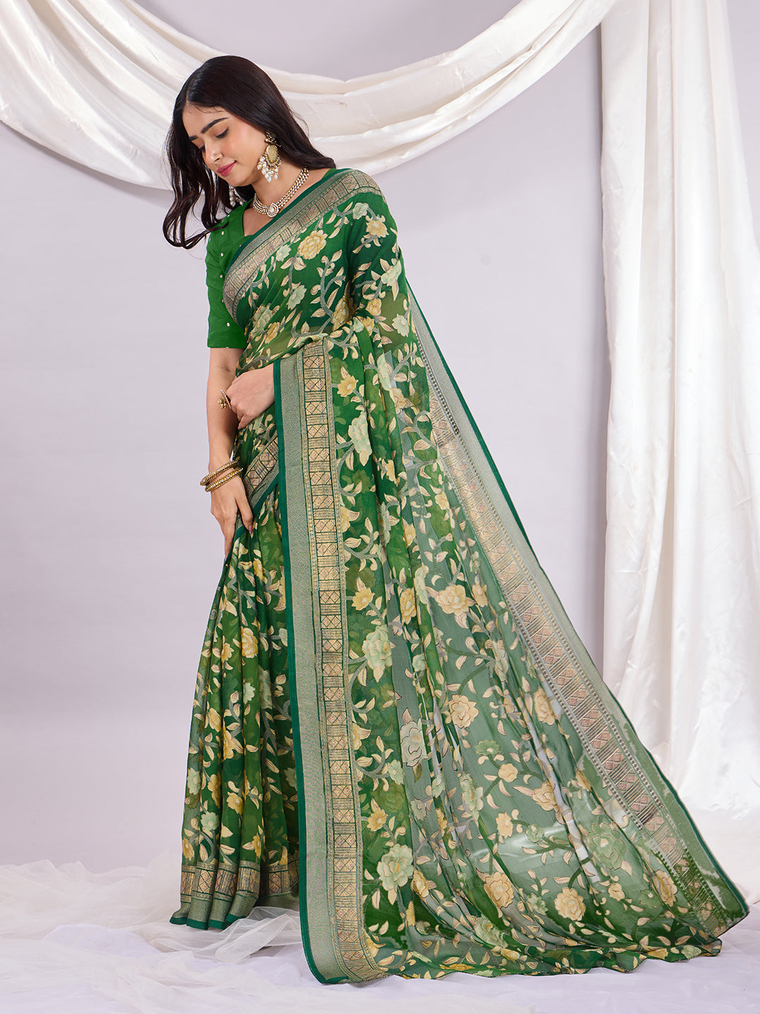 Premium Soft Brasso Saree With Fancy Blouse Piece.