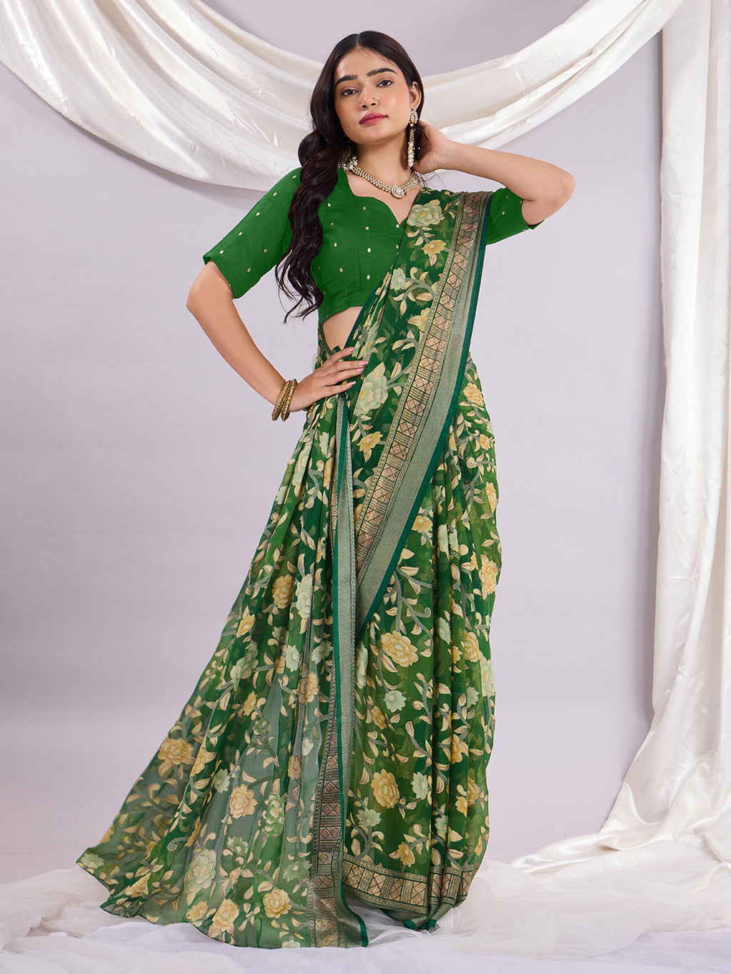 Premium Soft Brasso Saree With Fancy Blouse Piece.