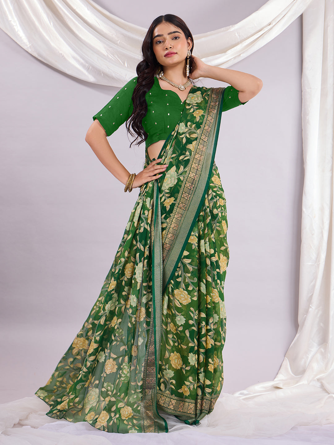 Premium Soft Brasso Saree With Fancy Blouse Piece.