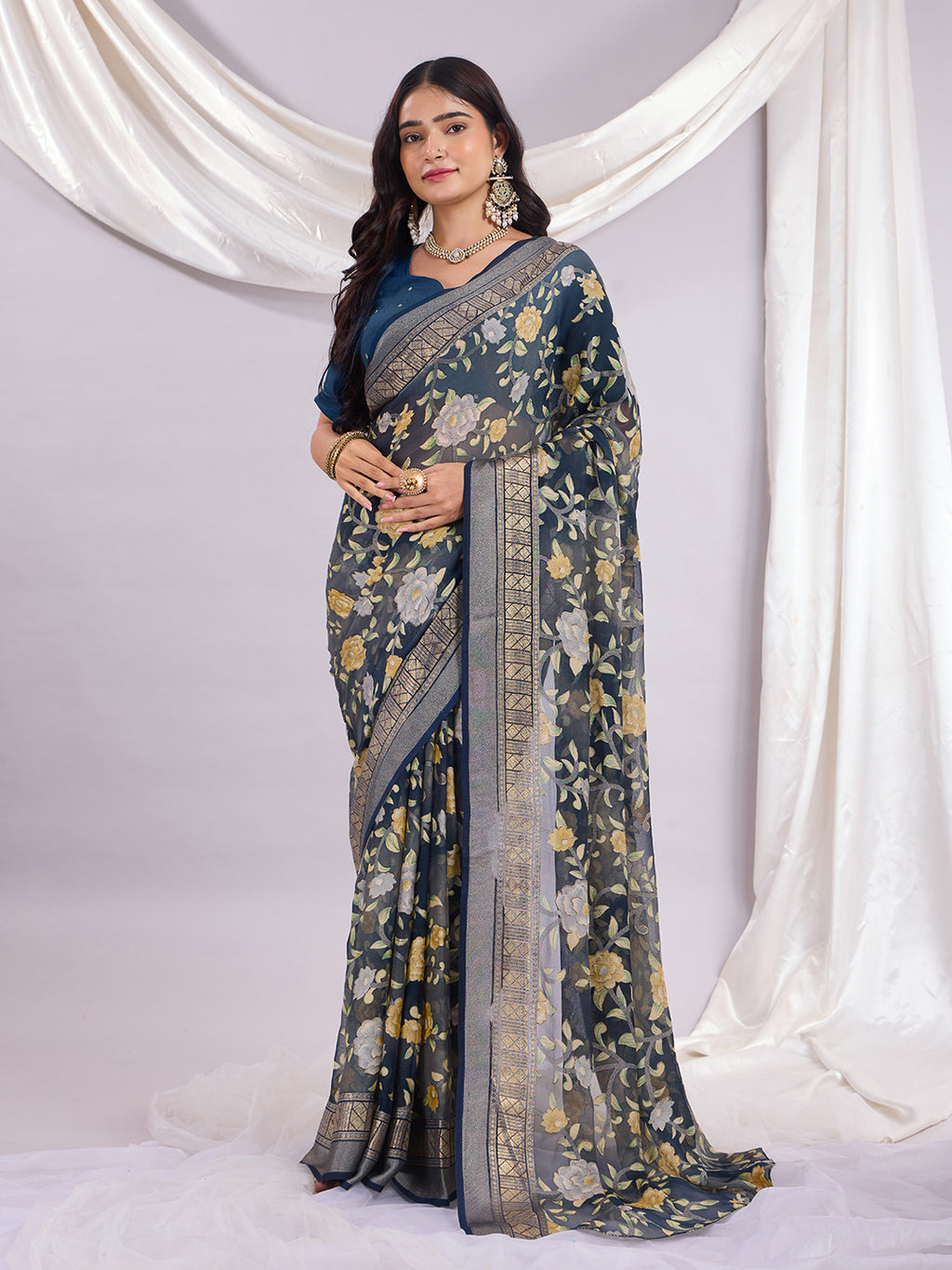 Premium Soft Brasso Saree With Fancy Blouse Piece.